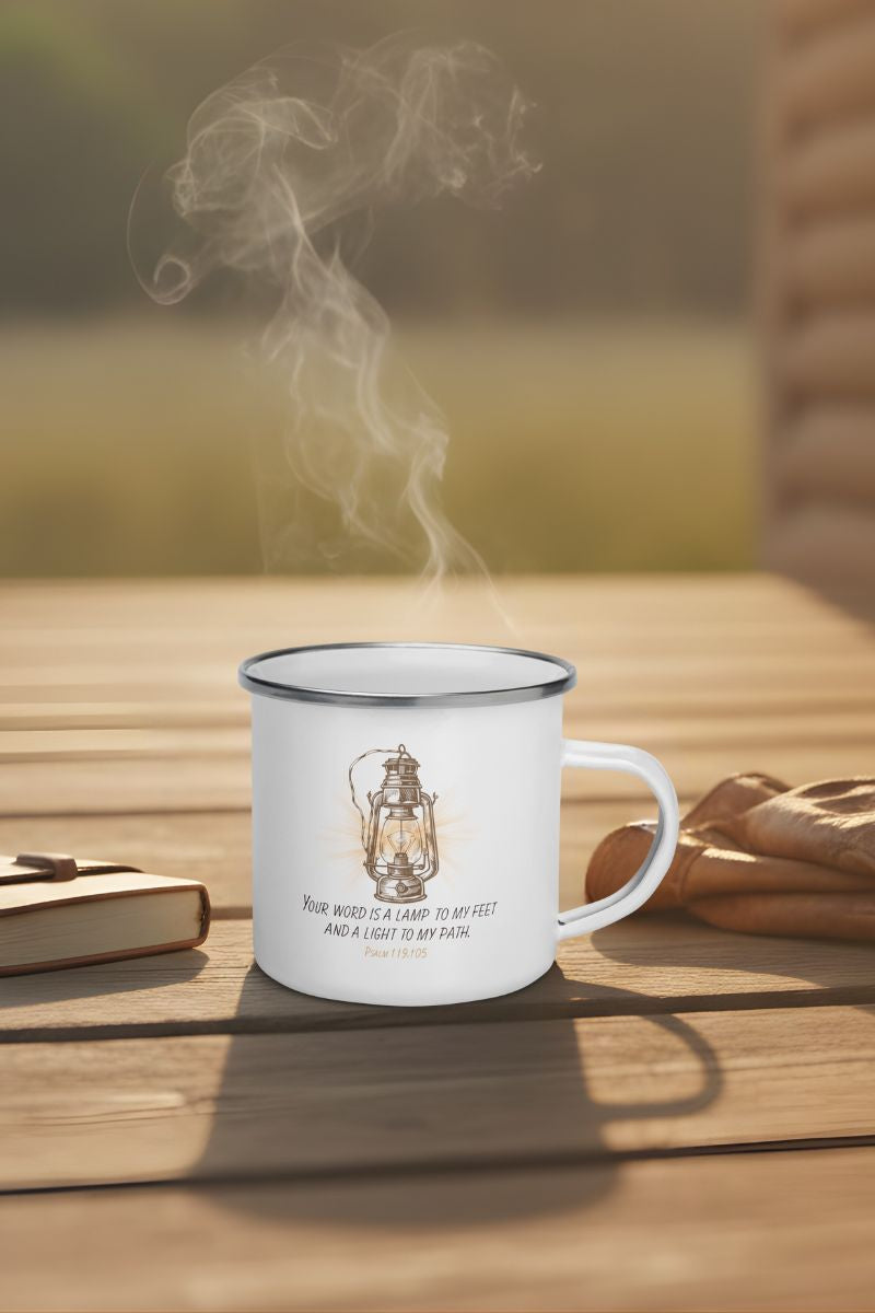 Steaming mug with a lantern design on a wooden surface with a blurred natural background